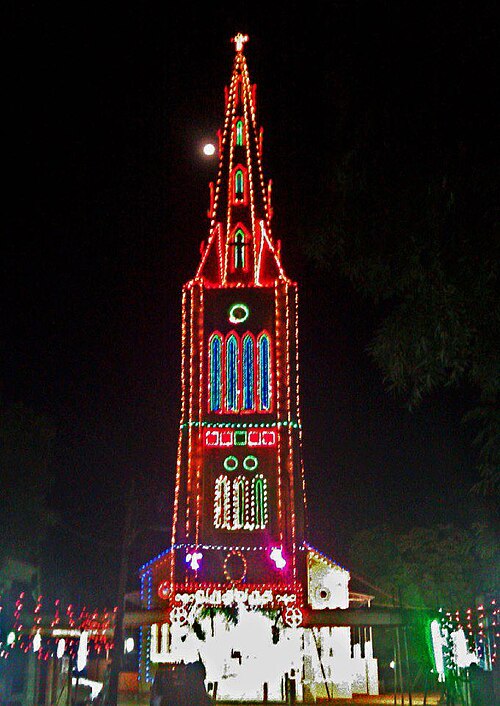 CSI Christ Church, Anbinnagaram bell tower illuminated at night for a festival